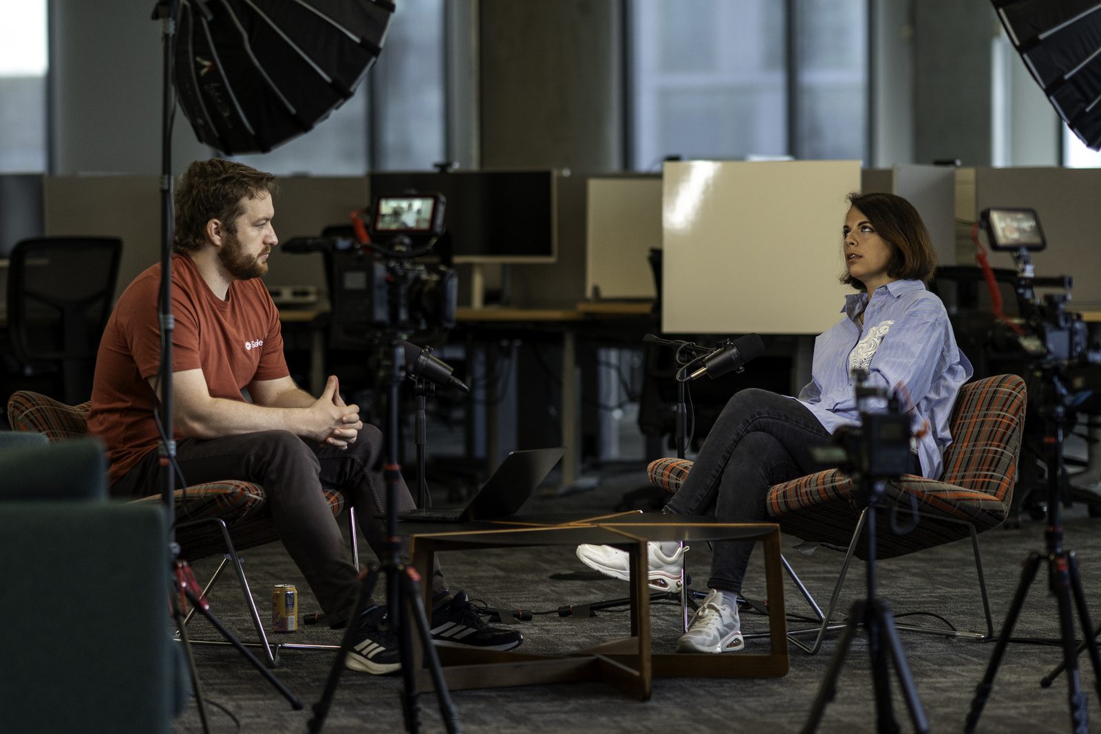 Conor Bronsdon recording a Chain of Thought episode on location, with a guest and a full camera and lighting setup